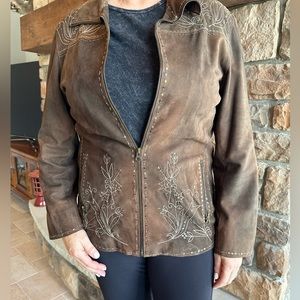 Sculpt suede coat with embellishments.